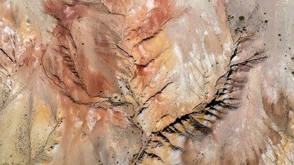 panoramic landscape with unusual red mountains with a Martian view filmed from a drone in Altai in May