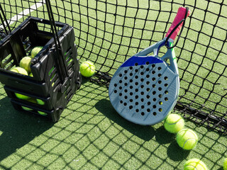 Paddle racket with a ball ready to play the fastest growing sport in recent years worldwide. Padel...