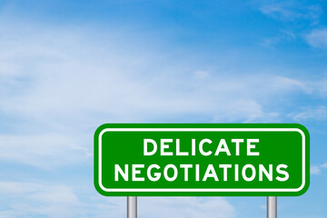 Green color transportation sign with word delicate negotiations on blue sky with white cloud...