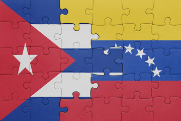 puzzle with the colourful national flag of venezuela and flag of cuba .
