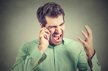 Furious businessman screaming on the phone