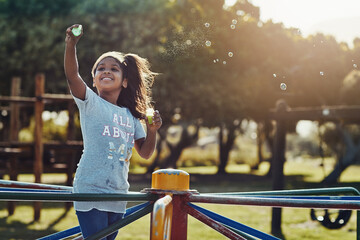 Play, girl and bubbles with playground, fun and love for summer break and positive. Kid, obstacle...