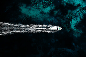 An expensive yacht sails on the ocean, top view