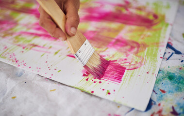 Floor, brush and hands with paper, painting and artist with mess for artwork, creative and art....
