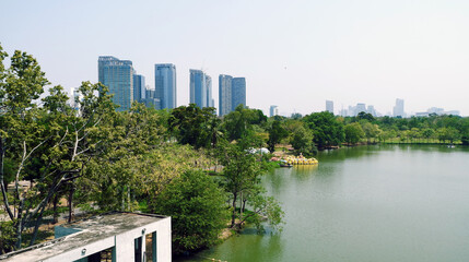 The view of the place through the window is of the lake and tall buildings.