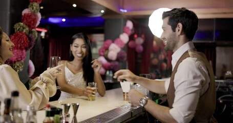A young Asian woman with long black hair sips wine in a restaurant on vacation. Feel relaxed during work in the bar counter. entertainment place. Concept real person	