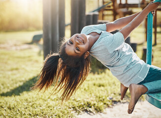Portrait, girl and playground roundabout with play and love for summer break and fun. Kid, playful...