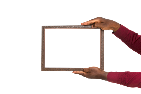 Black african hand holding rectangular wooden frame over transparent background - Powered by Adobe