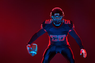 American football player banner on red neon background. Template for bookmaker ads with copy space. Mockup for betting advertisement. Sports betting, football betting, gambling, bookmaker, big win
