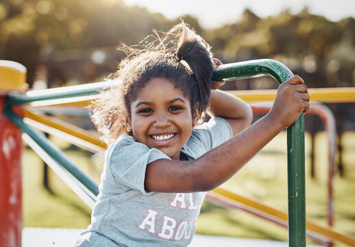 Portrait, girl and carousel with playground, fun and love for summer break and play. Kid, obstacle course and park equipment for joy, outside and happy child smile with countryside merry go round - Powered by Adobe