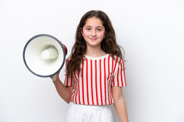 Little girl isolated on white background holding a megaphone and smiling a lot