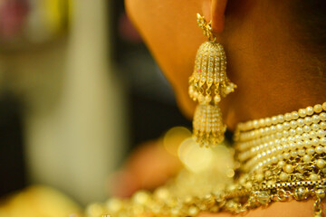 gold necklace and earrings