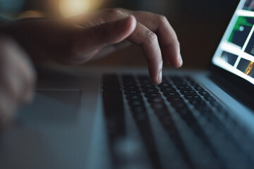 Hacker, hand and typing on laptop at night as thief for malware, hacking database software or...