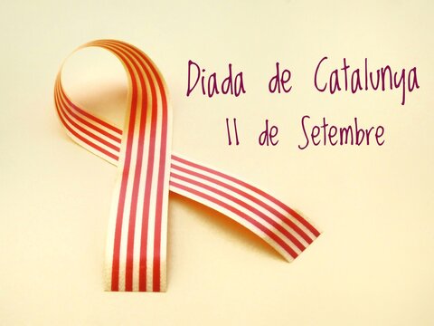 Poster for La Diada de Catalunya, Catalonia's National Day celebration on September 11, with text and a Senyera Catalan flag on a yellow background