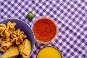 Batagor and Siomay with Peanut Sauce and Orange Juice a traditional Indonesian dish from Bandung