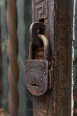 Closeup of an Old Rusted Padlock on a Gate