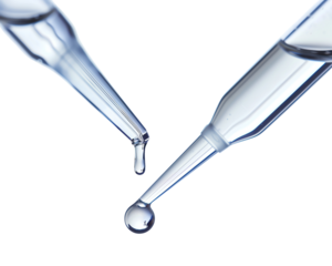 Close-up image of two laboratory pipettes with liquid droplets against a white background, perfect for science and medical themes.
