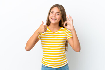 Little caucasian girl isolated on white background showing ok sign and thumb up gesture