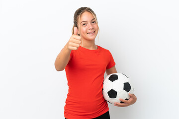 Little caucasian girl isolated on white background with soccer ball and with thumb up