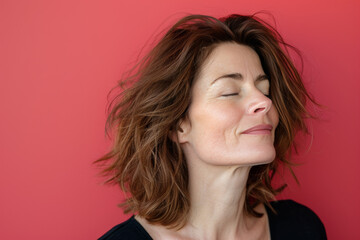 Fototapeta premium A close up of a woman's face with her eyes closed looking to a side