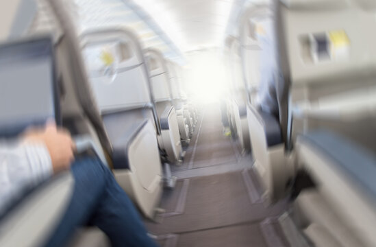 Aerophobias concept. Plane shakes during turbulence flying air hole. Blur image commercial plane moving fast downwards. Fear of flying. collapse slump, depression, downfall, debacle, subsidence, trip.
