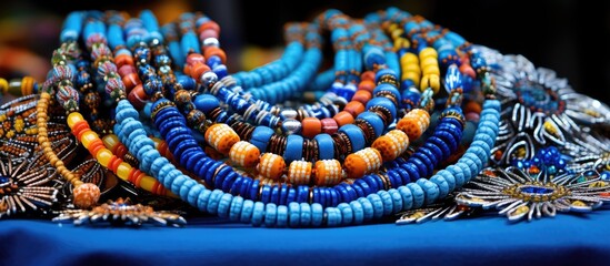 A colorful array of women's costume jewelry is displayed for sale in a craft store at Saras Mela, an annual fair exhibiting West Bengal's handicrafts, with a blank background for text or images