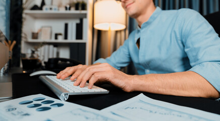 Cropped image of sales manager typing with keyboard with business paragraph dynamic data marketing...