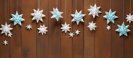 Frosty winter Christmas banner featuring white paper trees on a serene blue background with text space. Copy space image. Place for adding text and design