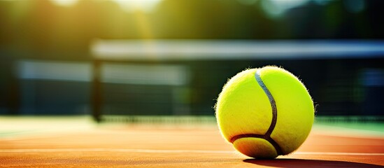 A tennis player getting ready to serve a ball, with a copy space image.