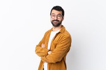 Caucasian handsome man with beard wearing a corduroy jacket over isolated white background with...