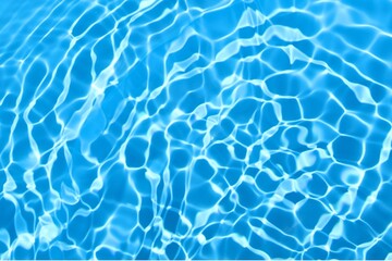 blue water ripples surface in swimming pool with sunlight reflections. blue water background