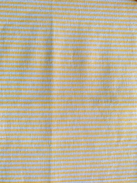 white and yellow thin vertical lines woven cotton fabric