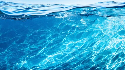 Fototapeta premium Abstract view of blue water surface with swirling currents, ideal for creative and artistic designs