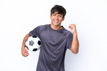 Handsome young football player man isolated on white background celebrating a victory in winner...