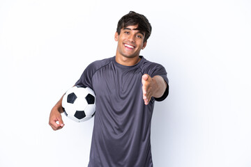 Handsome young football player man isolated on white background shaking hands for closing a good...