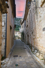 Obraz premium Saint-Guilhem-le-Desert in France, view of the village, typical street and houses 