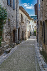 Saint-Guilhem-le-Desert in France, view of the village, typical street and houses
