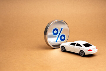 Car tax, loan, insurance and buying a car on installments. Big blue glowing percentage icon on...