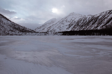 Snow-covered winter mountain lake, Russia, Siberia, Altai mountains.