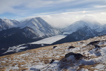 Snow-covered winter mountain lake, Russia, Siberia, Altai mountains.