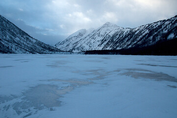 Snow-covered winter mountain lake, Russia, Siberia, Altai mountains.