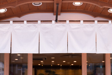 The curtain-like fabric that hangs in front of traditional Japanese restaurants and shops not only serves as a signboard, but holds a larger meaning,