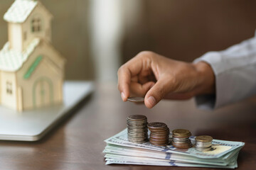Happy smart Asian woman saving money. saving and money concept.