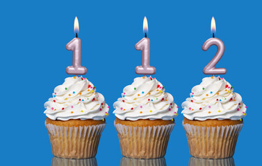 Birthday Cupcakes With Candles Lit Forming The Number 112