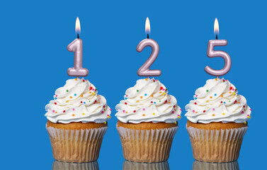 Birthday Cupcakes With Candles Lit Forming The Number 125