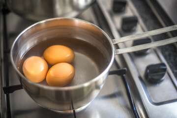 Three Eggs Boiling in Seville
