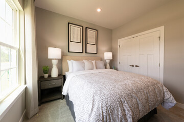 Fototapeta premium Bedroom interior. Modern bedroom design with lamps and furniture. Real estate concept.
