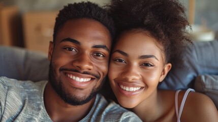 Close-up of a smiling young couple looking at the camera, exuding happiness and love