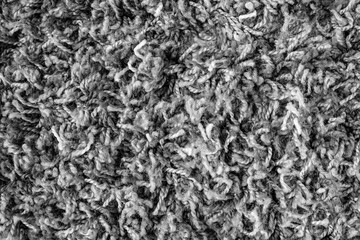 Fluffy synthetic textile rug or carpet background. Flooring fabric texture