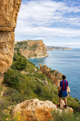 Hiking trail in Benitachell cliffs, from Moraig beach to Llebeig beach in Alicante (Spain)